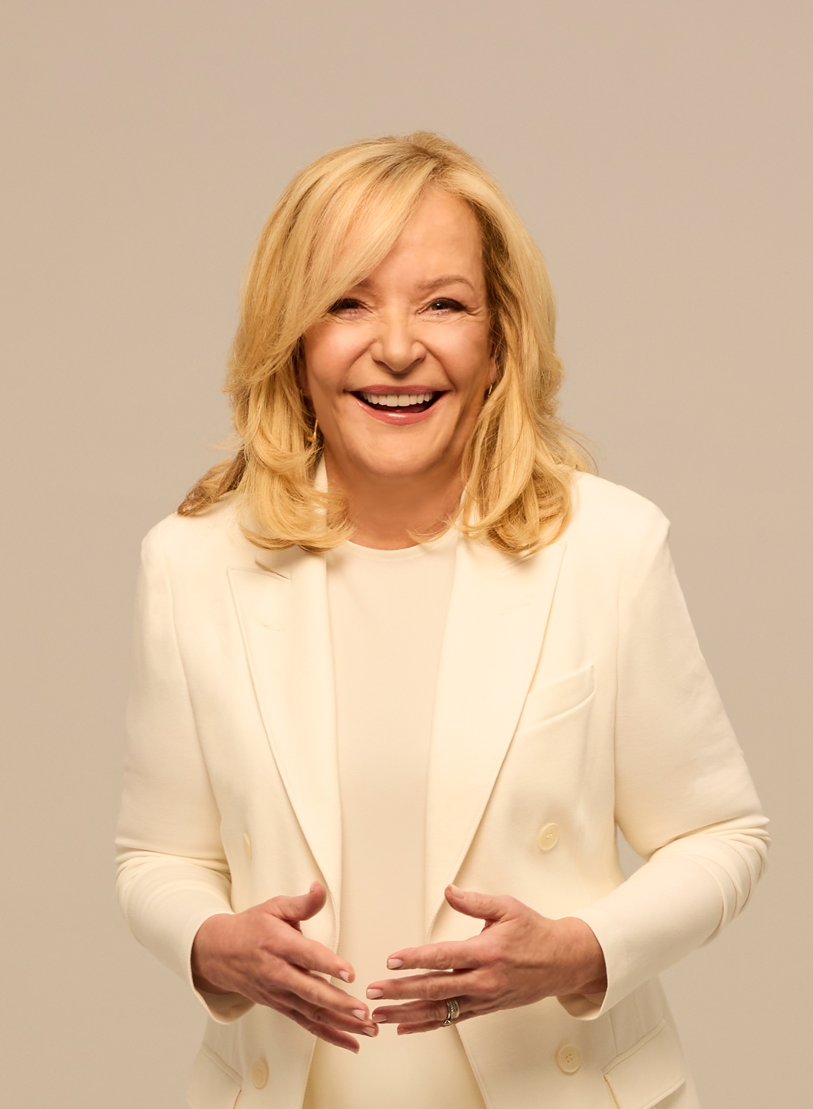 Marilyn Denis in a cream blazer, smiling